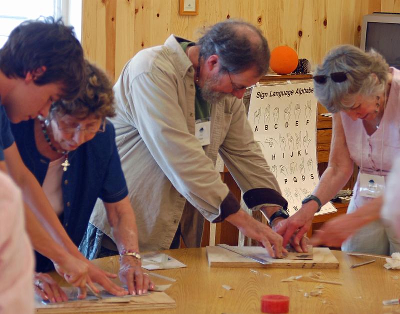 34 - Bob Frazier in Rod's Marquetry craft class.jpg - Stone Church member Bob Frazier (center) takes part in Rod Thorns craft class in wood veneer Marquetry.  The class made sixpointed stars.